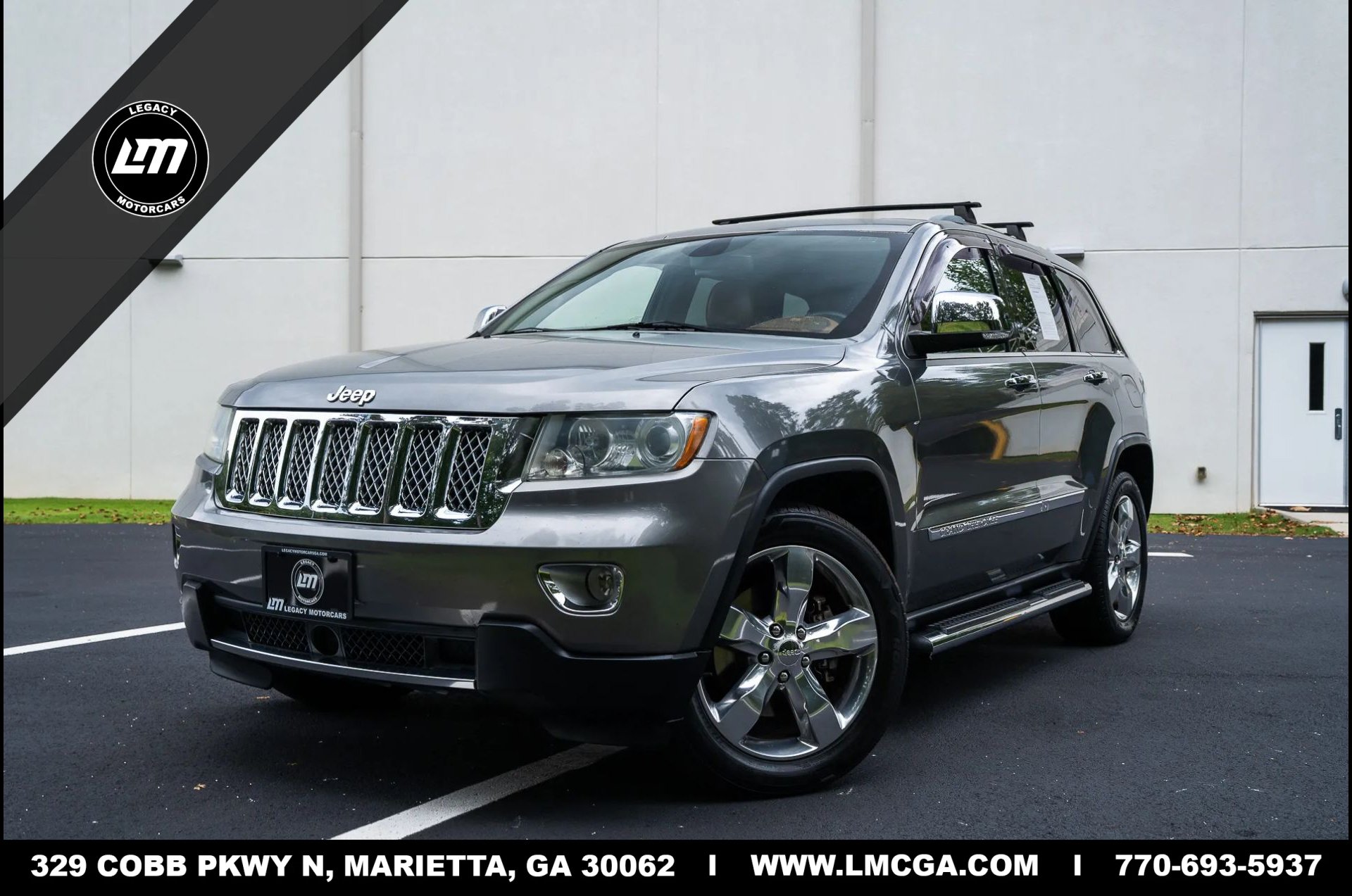 Used 2011 Jeep Grand Cherokee Overland Summit AWD/4WD image 1