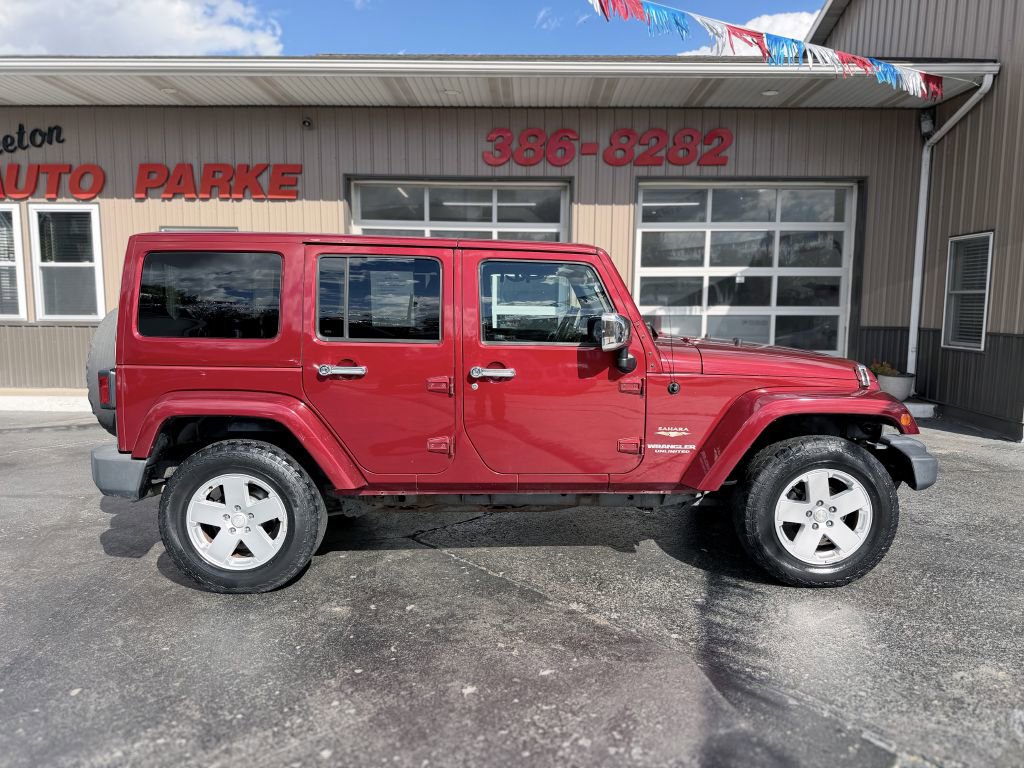 Used 2012 Jeep Wrangler Unlimited Sahara w/ Dual Top Group image 1