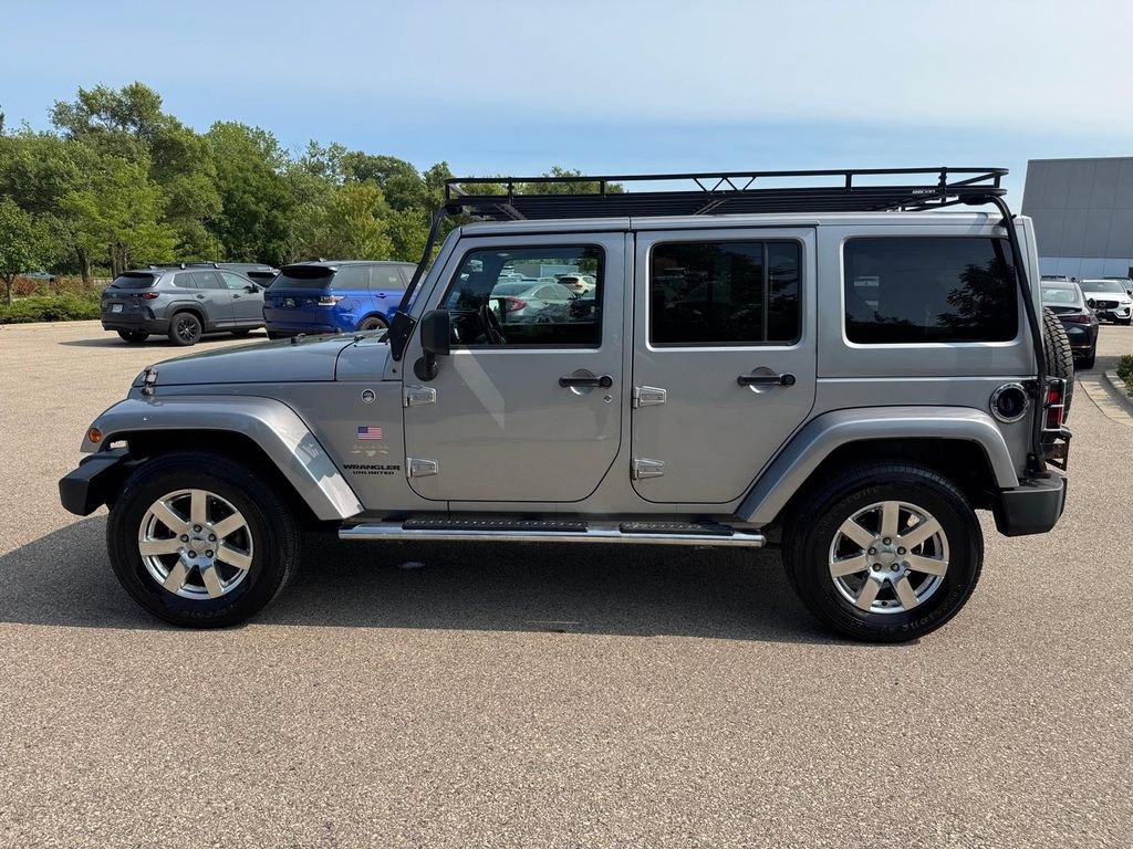 Used 2013 Jeep Wrangler Unlimited Sahara w/ Dual Top Group AWD/4WD image 2
