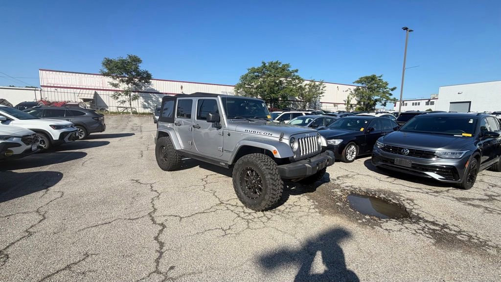 Used 2014 Jeep Wrangler Unlimited Rubicon w/ Dual Top Group AWD/4WD image 1