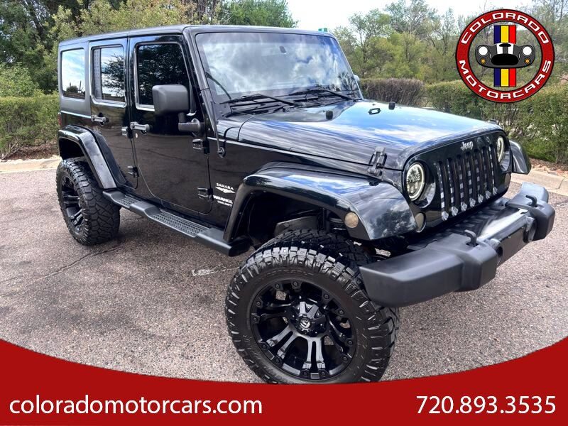 Used 2013 Jeep Wrangler Unlimited Sahara w/ Dual Top Group AWD/4WD image 1