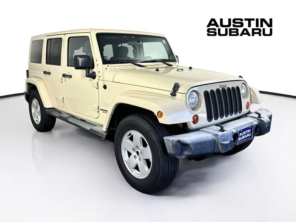 Used 2012 Jeep Wrangler Unlimited Sahara w/ Dual Top Group AWD/4WD image 1