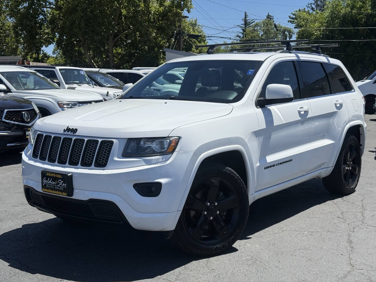 Used 2015 Jeep Grand Cherokee Altitude AWD/4WD image 1