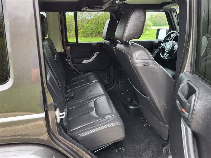 Used 2014 Jeep Wrangler Unlimited Sahara w/ Dual Top Group AWD/4WD image 14