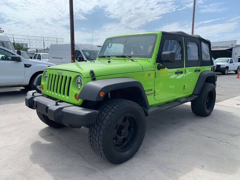 Used 2013 Jeep Wrangler Unlimited Sport w/ Mopar Black Appearance Group image 3
