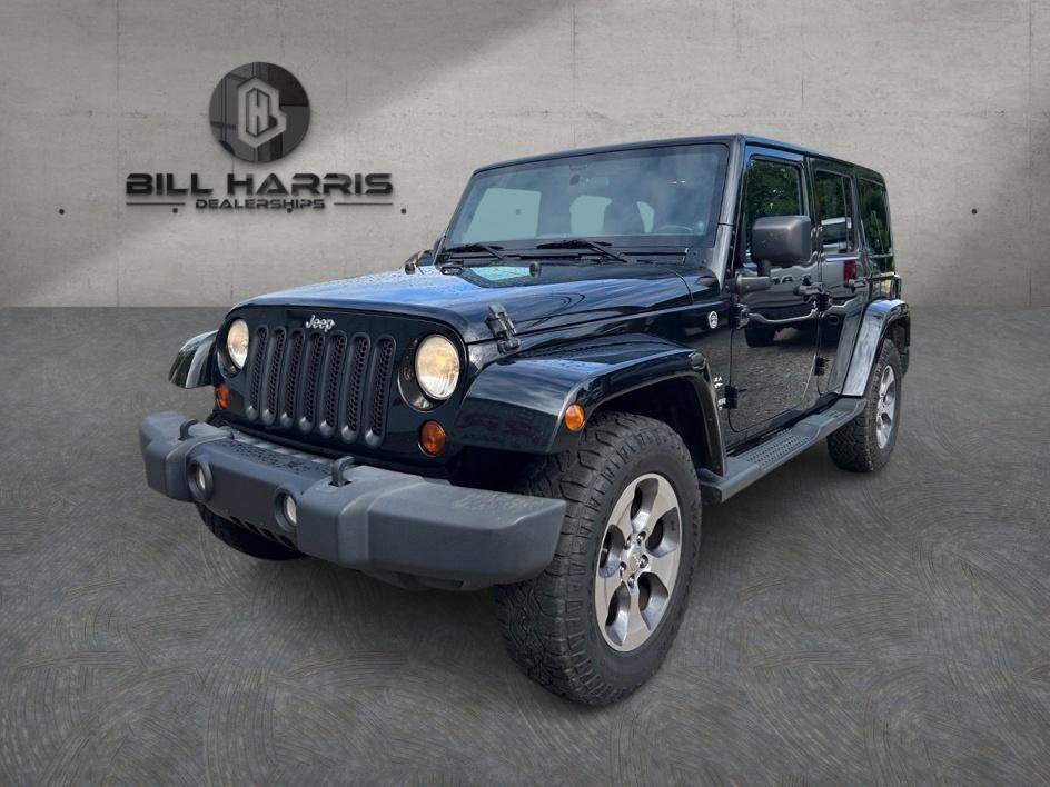 Used 2012 Jeep Wrangler Unlimited Sahara w/ Dual Top Group AWD/4WD image 1