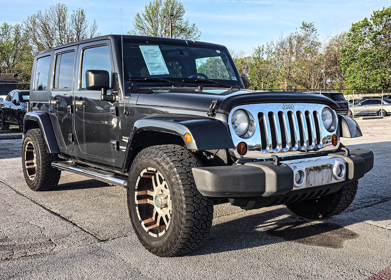 Used 2010 Jeep Wrangler Unlimited Sahara w/ Dual Top Group image 1