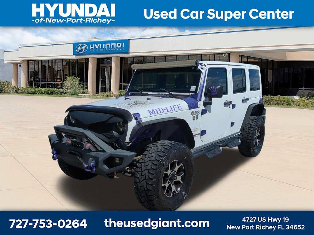 Used 2014 Jeep Wrangler Unlimited Sahara w/ Dual Top Group AWD/4WD image 1