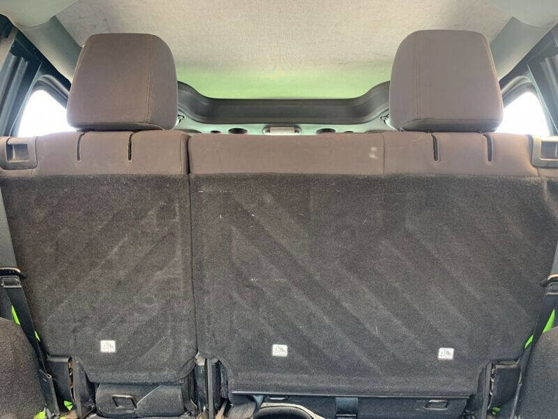 Used 2013 Jeep Wrangler Unlimited Sport w/ Mopar Black Appearance Group image 14