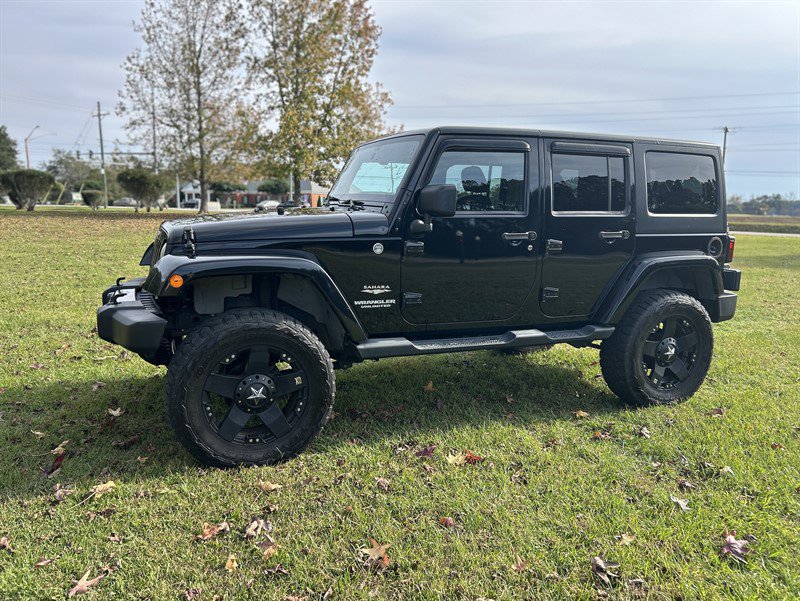 Used 2013 Jeep Wrangler Unlimited Sahara w/ Dual Top Group image 1