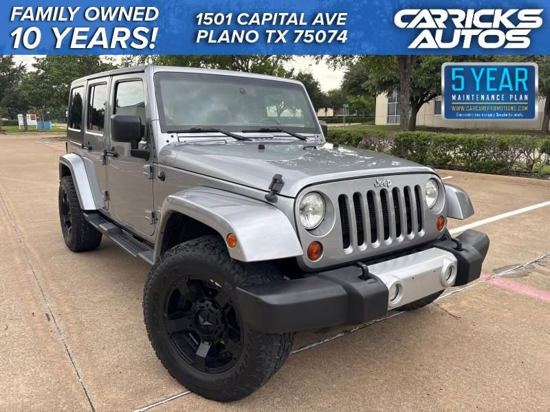 Used 2013 Jeep Wrangler Unlimited Sahara w/ Dual Top Group AWD/4WD image 1