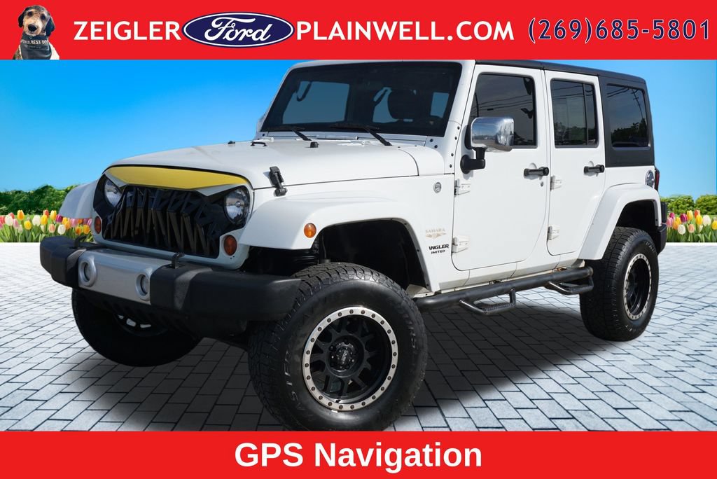 Used 2012 Jeep Wrangler Unlimited Sahara w/ Dual Top Group AWD/4WD image 1