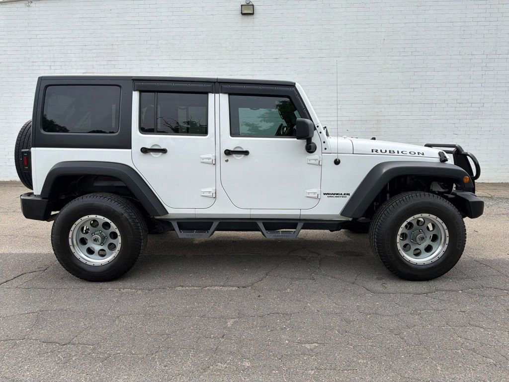 Used 2011 Jeep Wrangler Unlimited Rubicon w/ Dual Top Group AWD/4WD image 1
