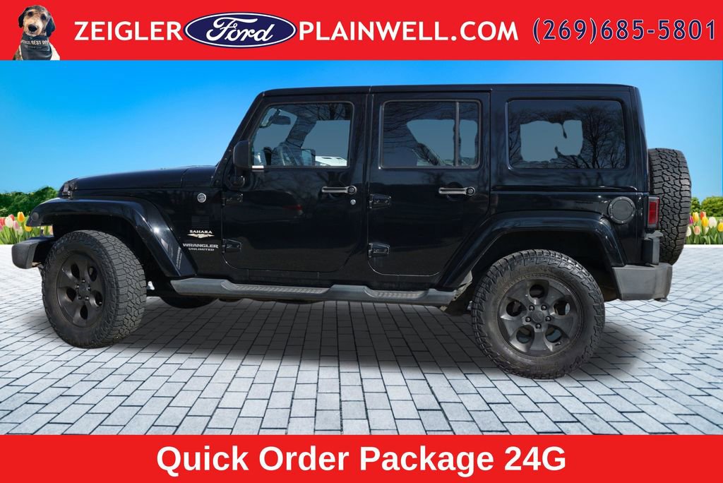 Used 2014 Jeep Wrangler Unlimited Sahara w/ Dual Top Group AWD/4WD image 2