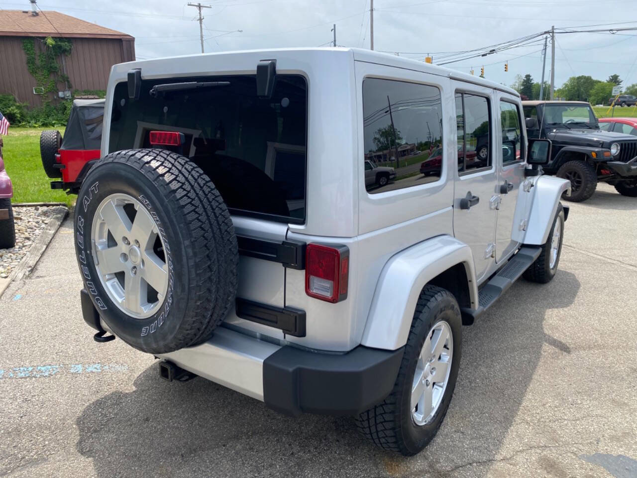 Used 2012 Jeep Wrangler Unlimited Sahara w/ Dual Top Group AWD/4WD image 6