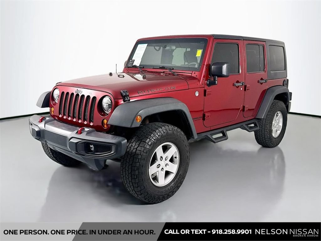 Used 2012 Jeep Wrangler Unlimited Rubicon w/ Dual Top Group AWD/4WD image 1