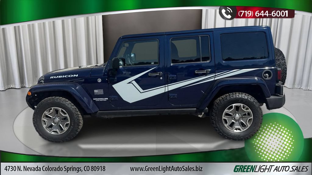 Used 2013 Jeep Wrangler Unlimited Rubicon w/ Dual Top Group AWD/4WD image 2