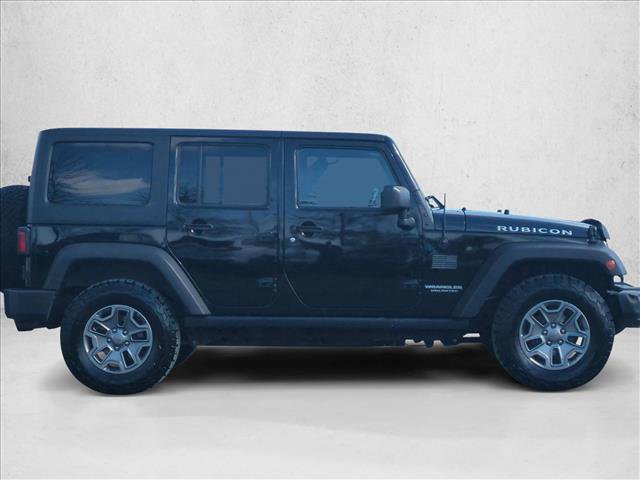 Used 2015 Jeep Wrangler Unlimited Rubicon w/ Connectivity Group AWD/4WD video 4