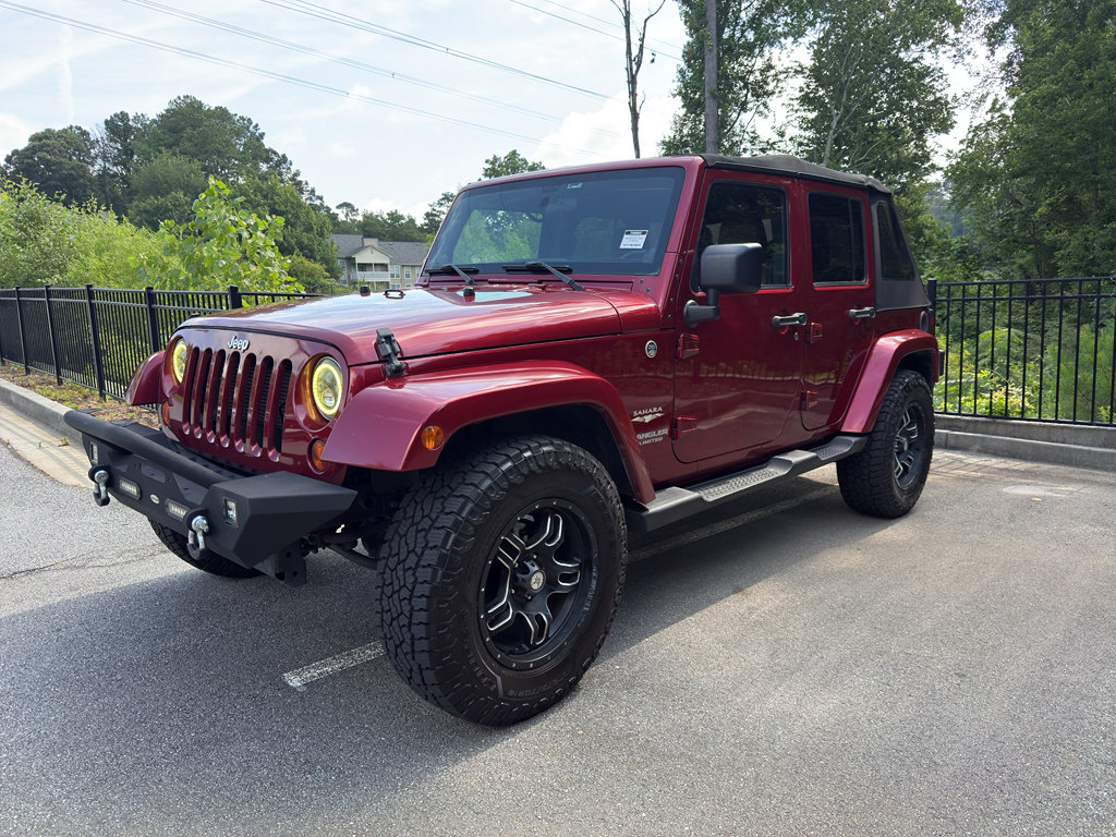 Used 2012 Jeep Wrangler Unlimited Sahara w/ Dual Top Group AWD/4WD image 1