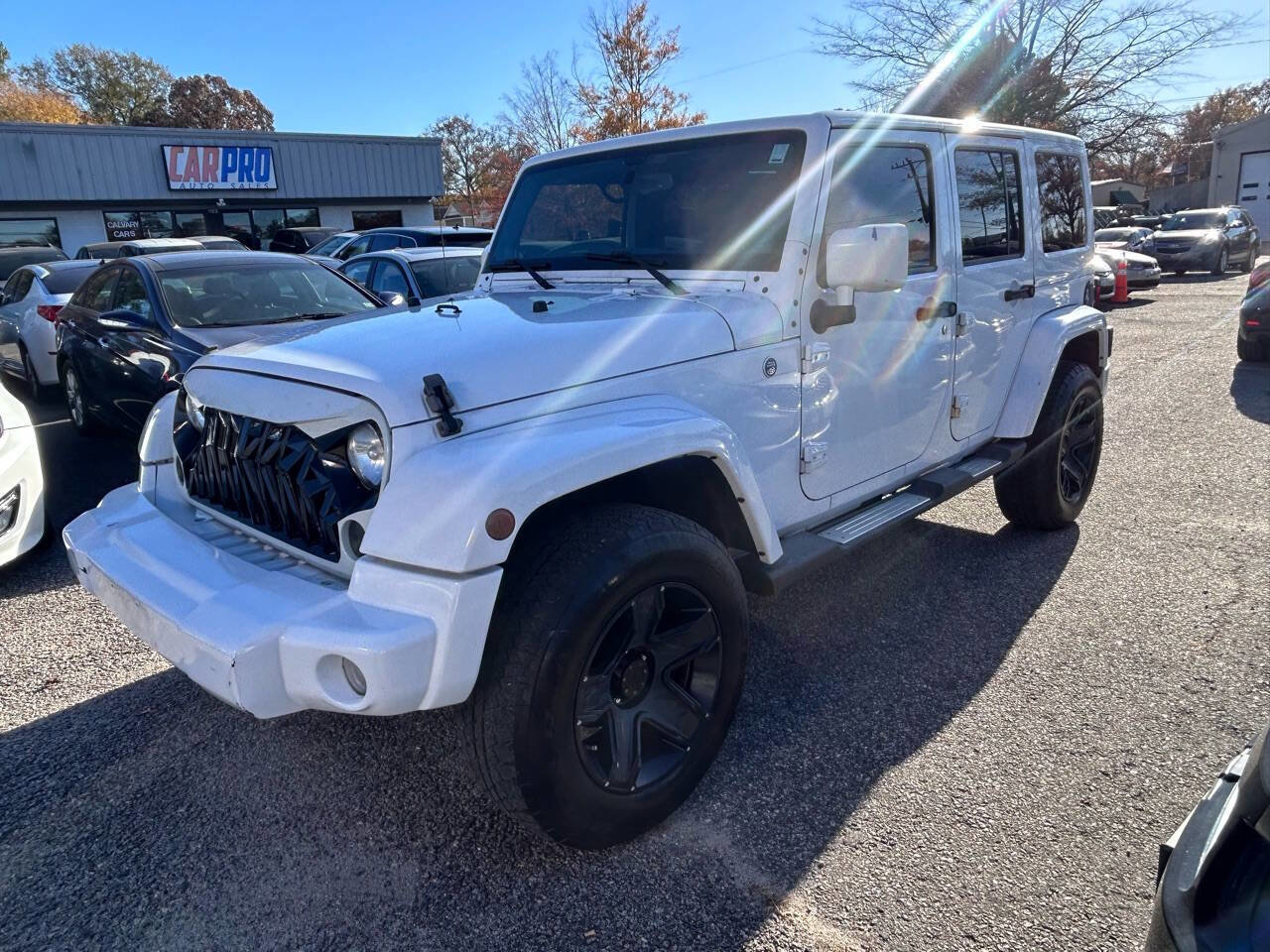 Used 2013 Jeep Wrangler Unlimited Sahara w/ Dual Top Group image 2