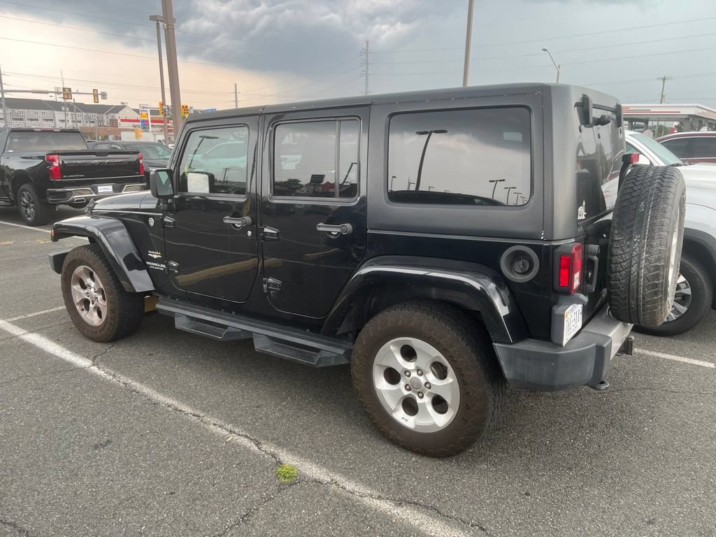 Used 2013 Jeep Wrangler Unlimited Sahara w/ Dual Top Group AWD/4WD image 2