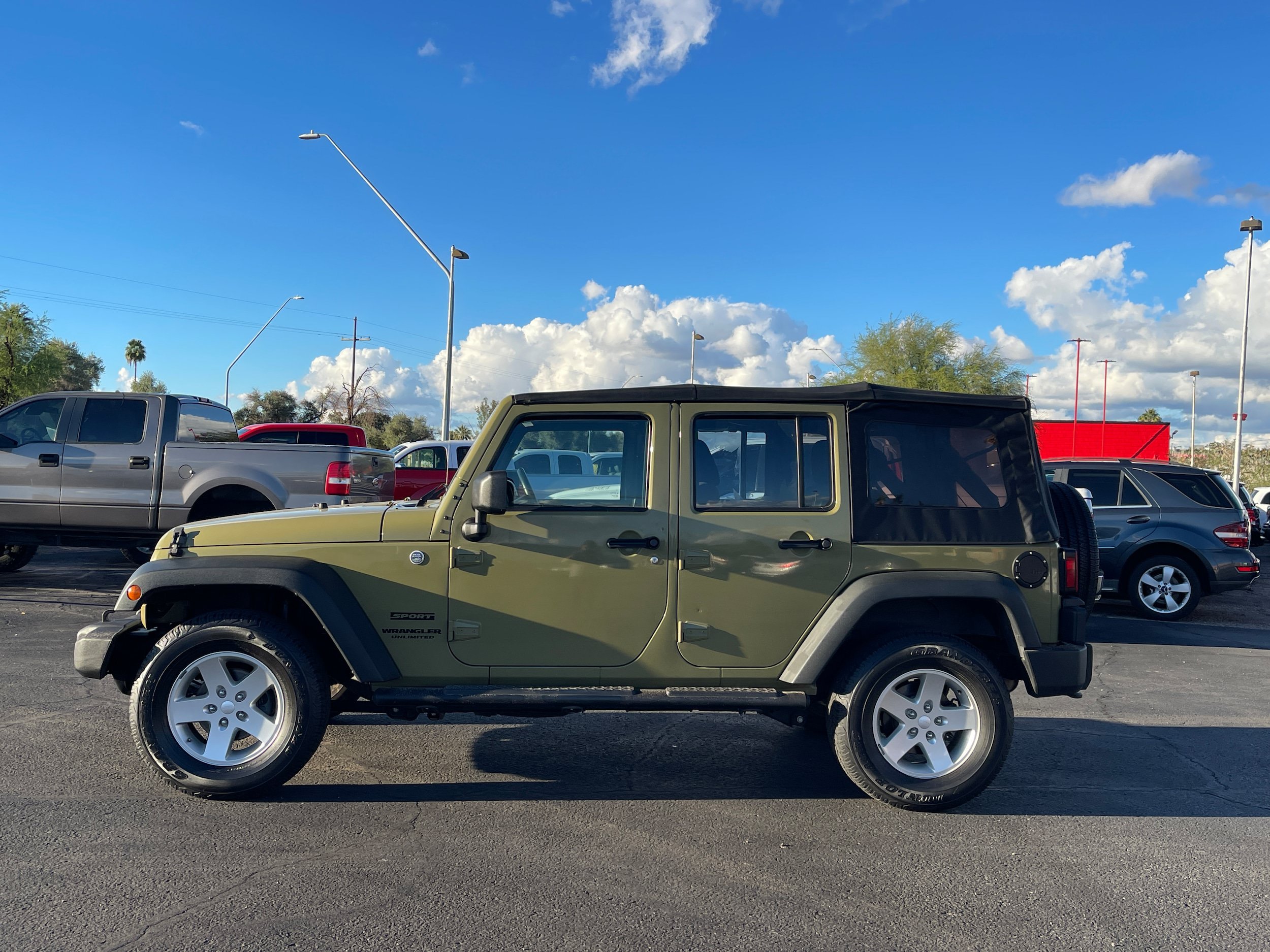Used 2013 Jeep Wrangler Unlimited Sport w/ Mopar Black Appearance Group AWD/4WD image 2