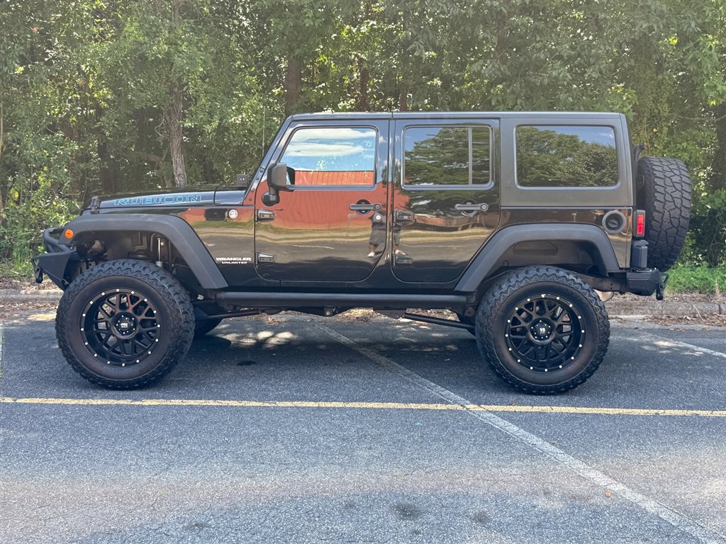 Used 2015 Jeep Wrangler Unlimited Rubicon w/ Dual Top Group AWD/4WD image 17
