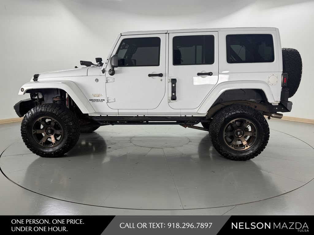 Used 2014 Jeep Wrangler Unlimited Sahara w/ Mopar Chrome Edition Group AWD/4WD image 9