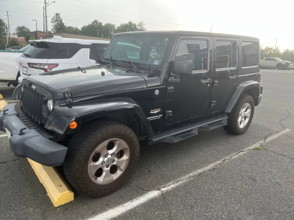Used 2013 Jeep Wrangler Unlimited Sahara w/ Dual Top Group AWD/4WD image 1