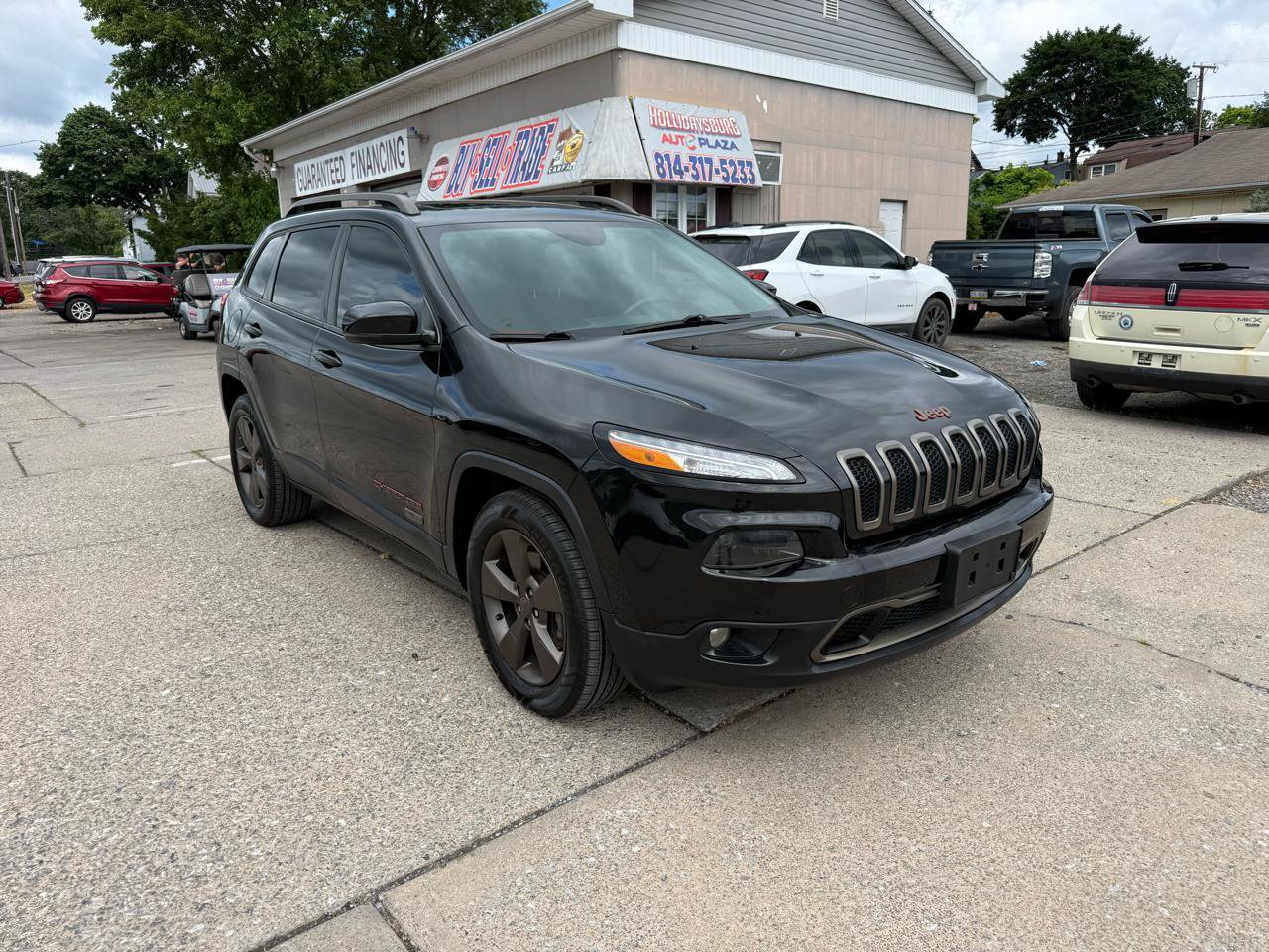 Used 2016 Jeep Cherokee 75th Anniversary AWD/4WD image 1