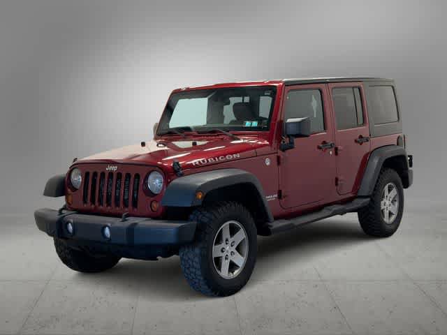 Used 2012 Jeep Wrangler Unlimited Rubicon w/ Dual Top Group AWD/4WD image 1
