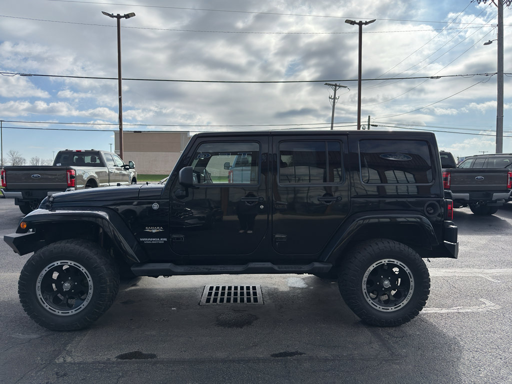 Used 2012 Jeep Wrangler Unlimited Sahara w/ Dual Top Group AWD/4WD image 2