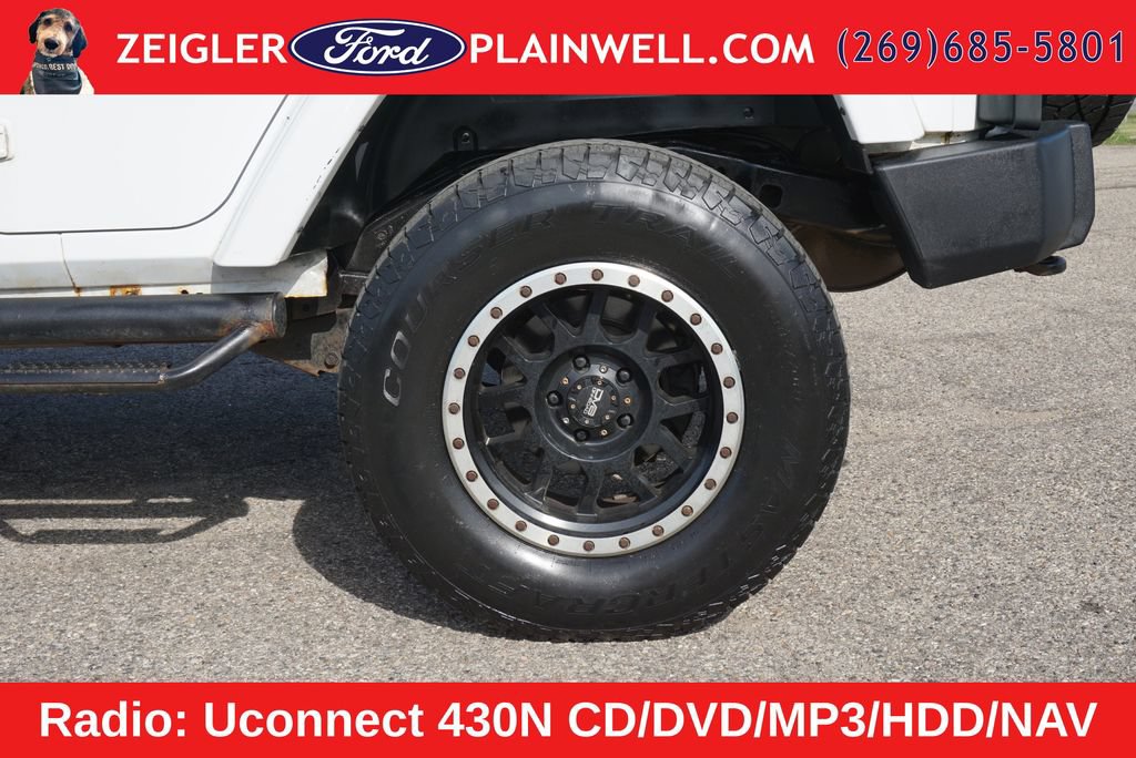 Used 2012 Jeep Wrangler Unlimited Sahara w/ Dual Top Group AWD/4WD image 9