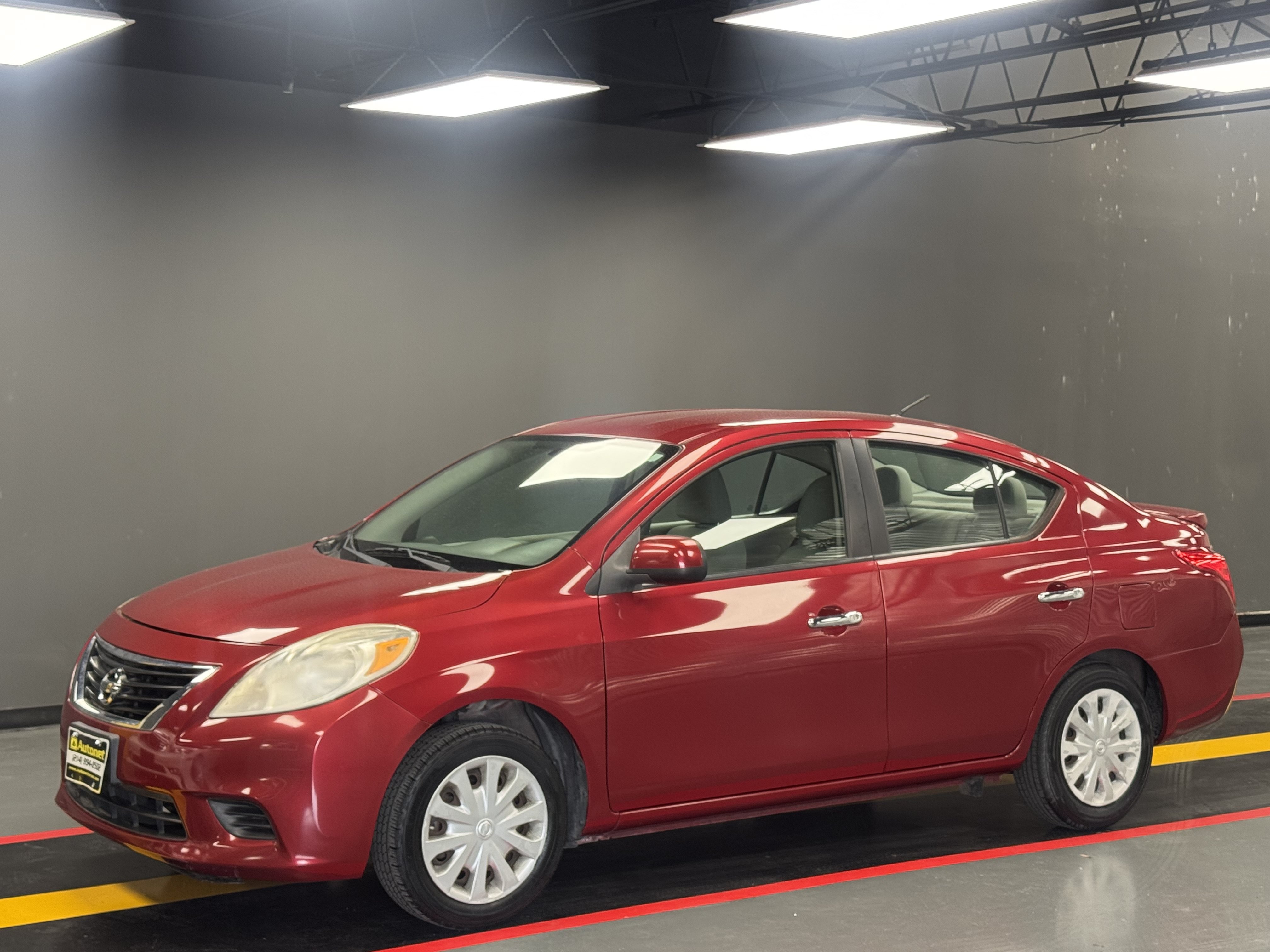 Used 2013 Nissan Versa SV FWD image 1