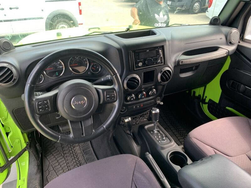 Used 2013 Jeep Wrangler Unlimited Sport w/ Mopar Black Appearance Group image 17