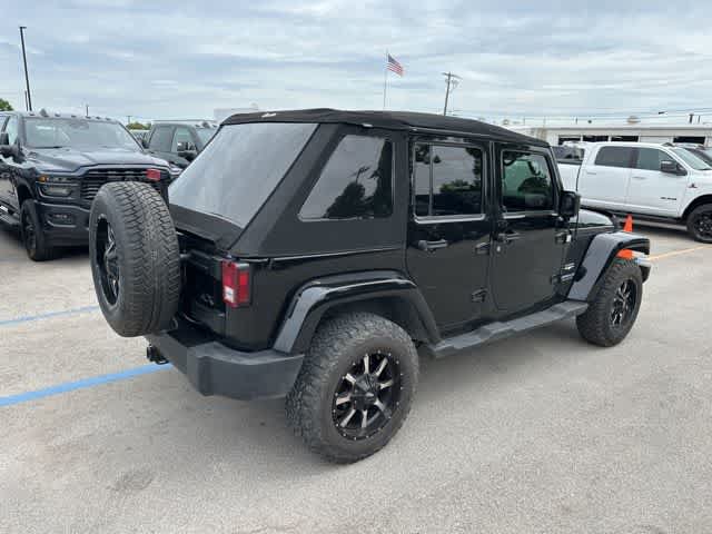 Used 2012 Jeep Wrangler Unlimited Sahara w/ Dual Top Group AWD/4WD image 16
