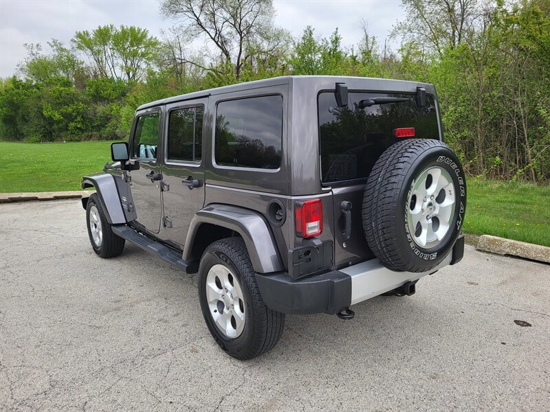 Used 2014 Jeep Wrangler Unlimited Sahara w/ Dual Top Group AWD/4WD image 9