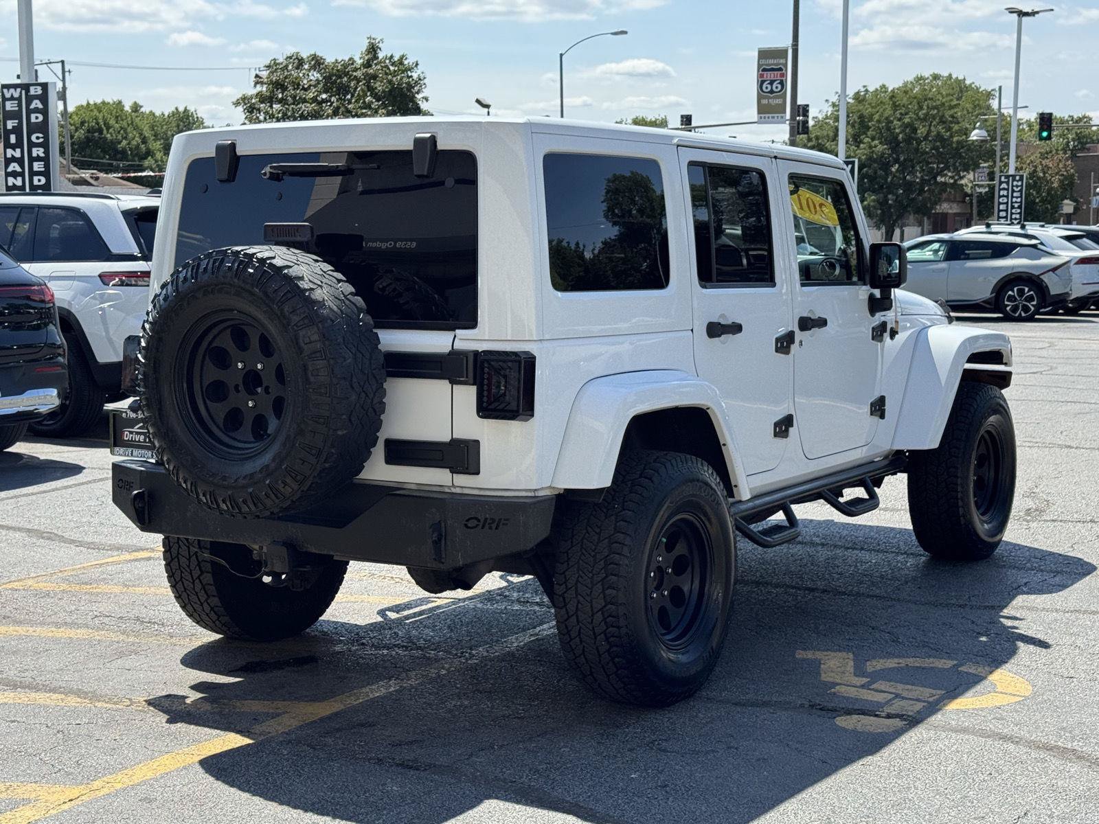 Used 2012 Jeep Wrangler Unlimited Sahara w/ Dual Top Group AWD/4WD image 11