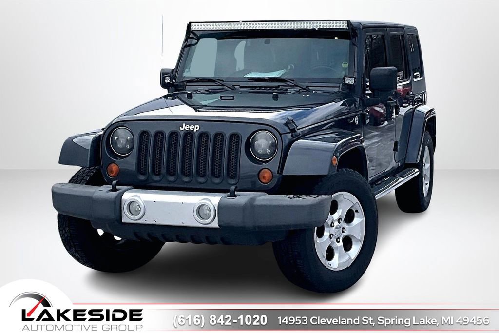 Used 2010 Jeep Wrangler Unlimited Sahara w/ Dual Top Group image 1