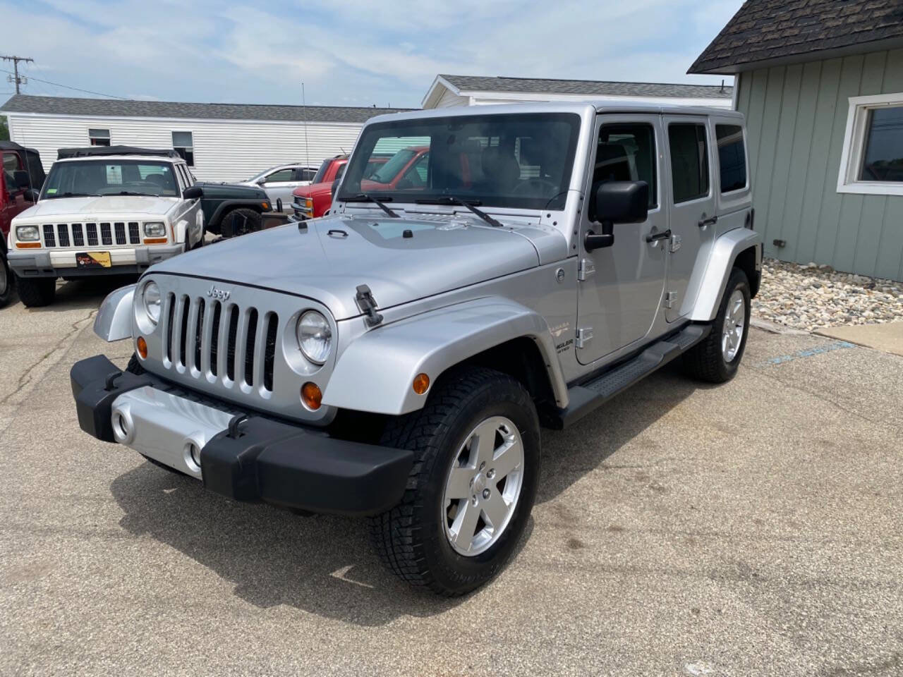 Used 2012 Jeep Wrangler Unlimited Sahara w/ Dual Top Group AWD/4WD image 2