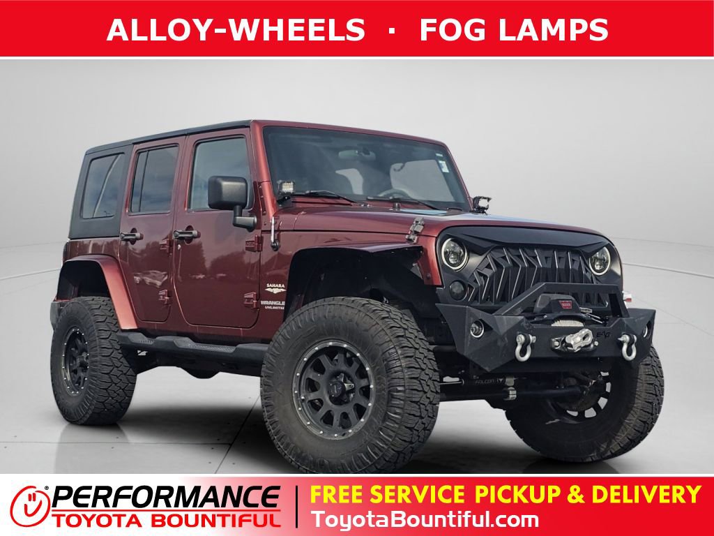 Used 2010 Jeep Wrangler Unlimited Sahara w/ Dual Top Group AWD/4WD video 1