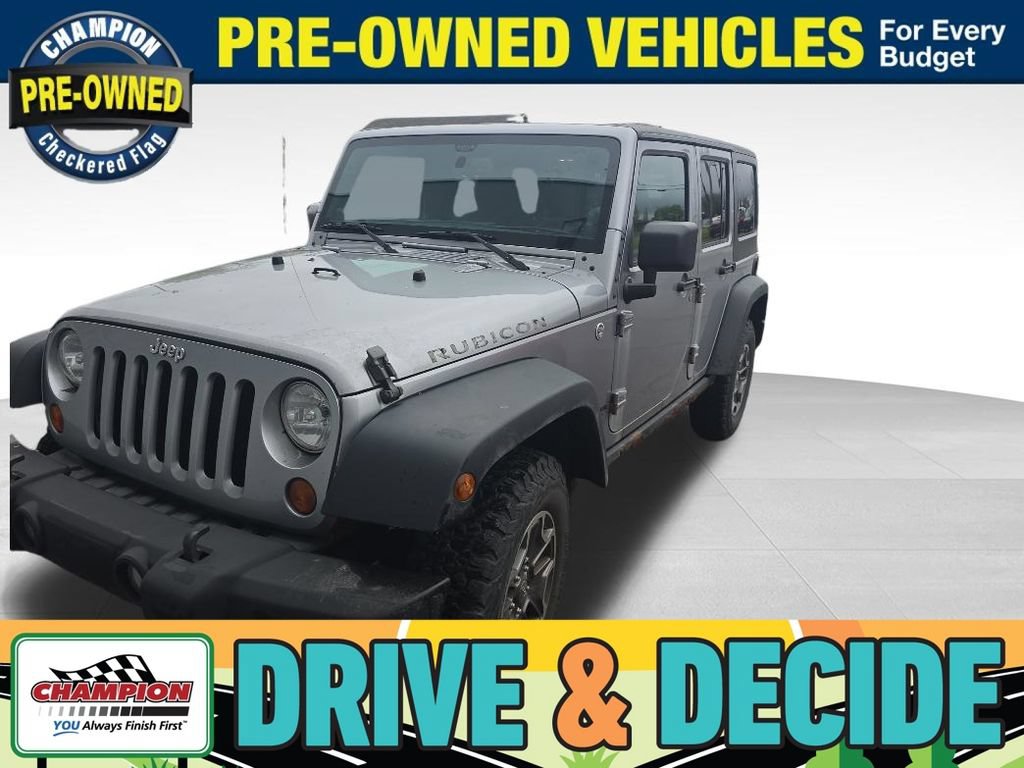 Used 2013 Jeep Wrangler Unlimited Rubicon w/ Dual Top Group AWD/4WD image 1