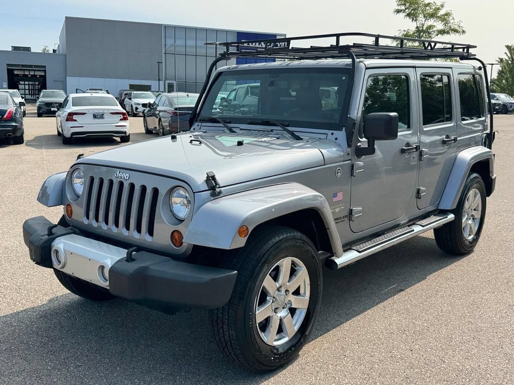 Used 2013 Jeep Wrangler Unlimited Sahara w/ Dual Top Group AWD/4WD image 1