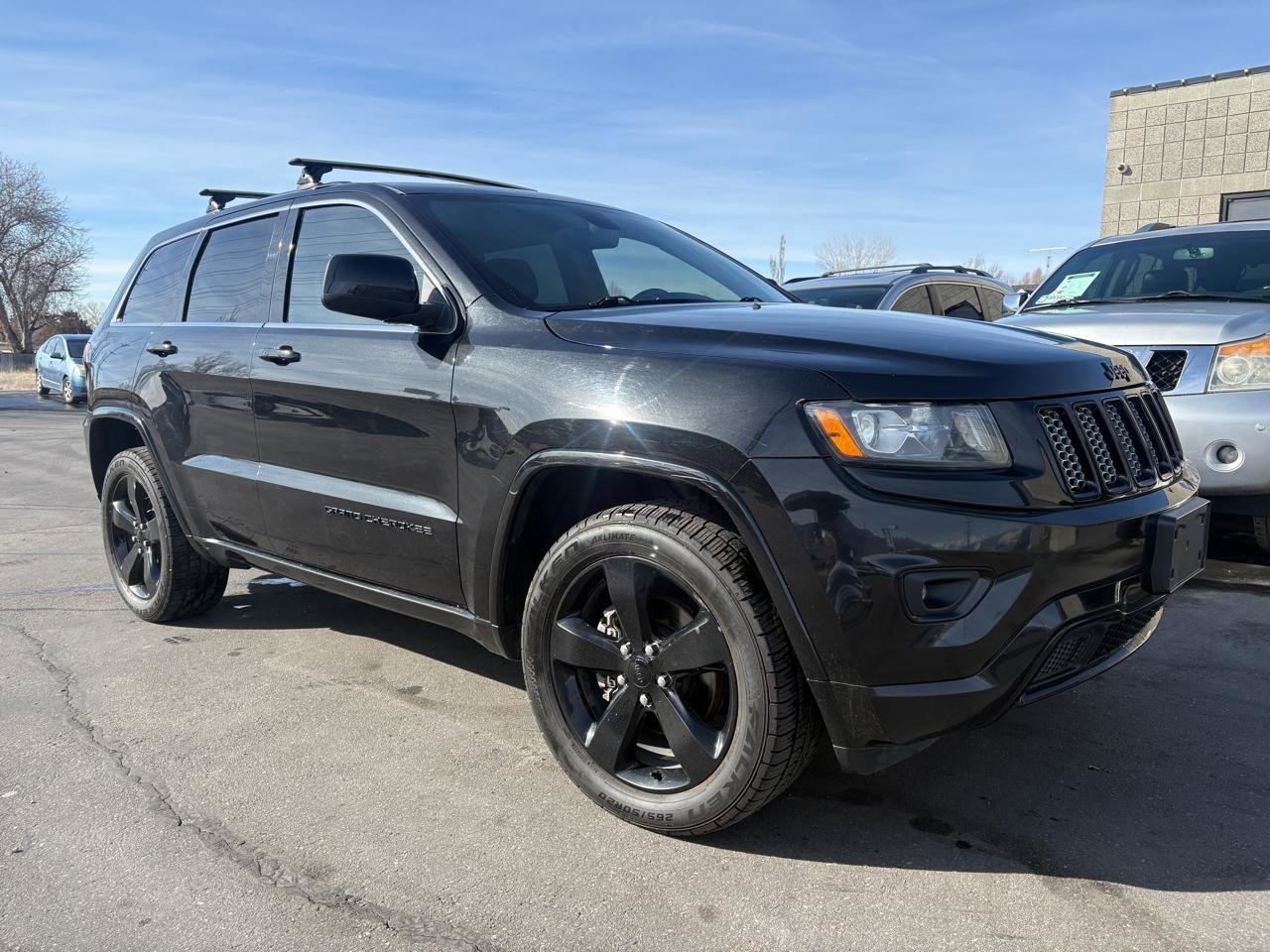 Used 2015 Jeep Grand Cherokee Altitude image 1