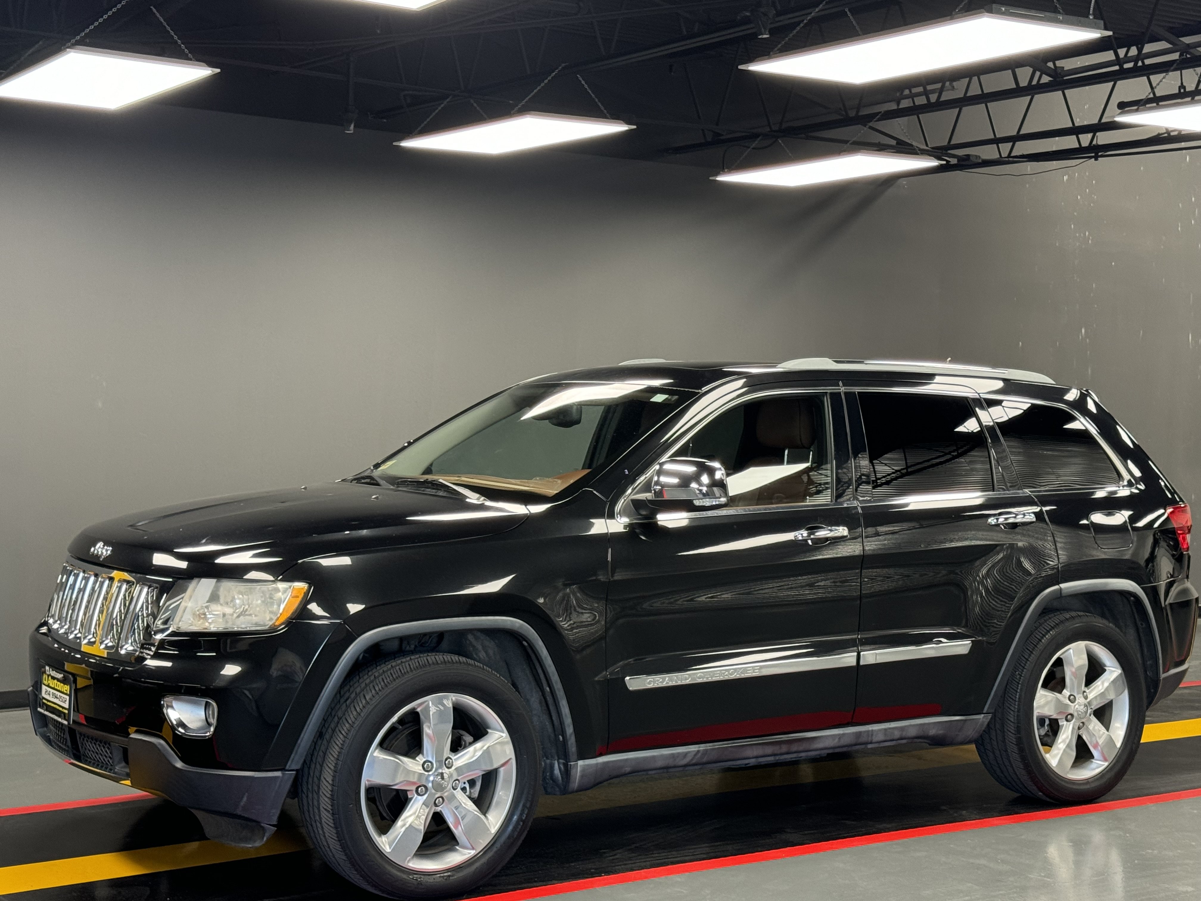 Used 2011 Jeep Grand Cherokee Overland Summit AWD/4WD image 1