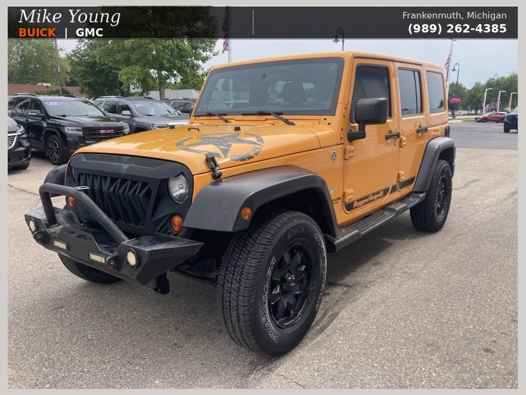 Used 2012 Jeep Wrangler Unlimited Sahara w/ Dual Top Group AWD/4WD image 1