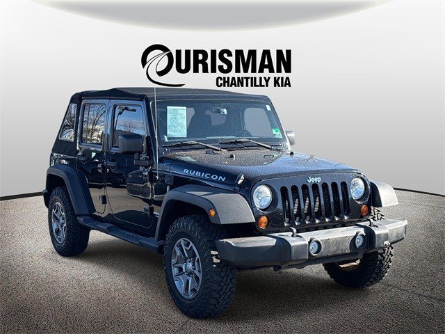 Used 2013 Jeep Wrangler Unlimited Rubicon w/ Dual Top Group image 1