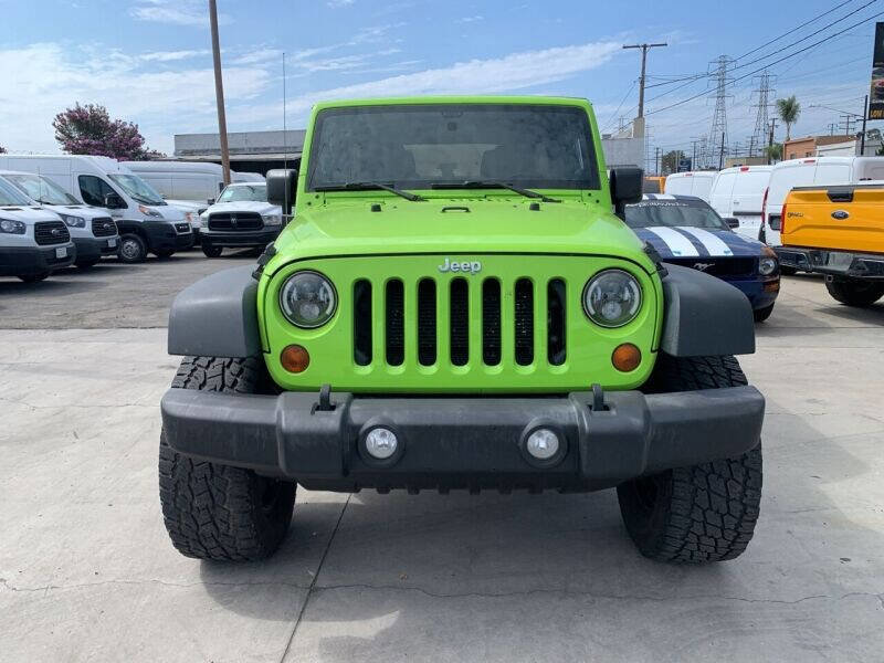 Used 2013 Jeep Wrangler Unlimited Sport w/ Mopar Black Appearance Group image 2