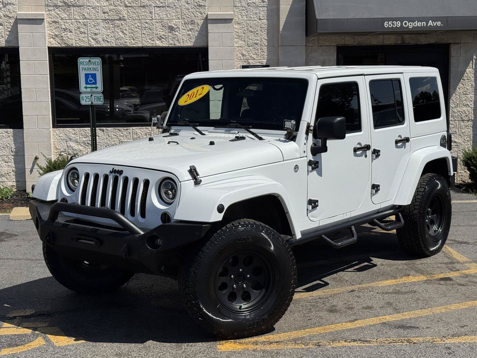 Used 2012 Jeep Wrangler Unlimited Sahara w/ Dual Top Group AWD/4WD image 2