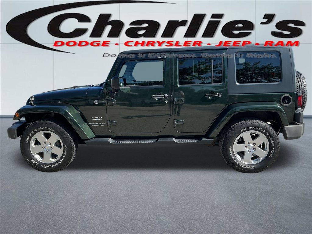 Used 2010 Jeep Wrangler Unlimited Sahara w/ Dual Top Group AWD/4WD image 1